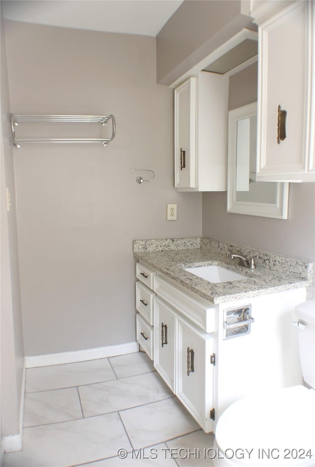 bathroom with vanity and tile patterned floors