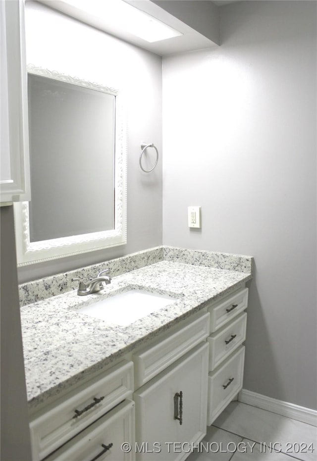 bathroom with vanity and tile patterned flooring