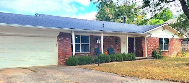 single story home featuring a front yard and a garage