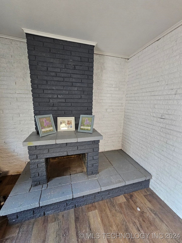 exterior details featuring wood-type flooring and ornamental molding