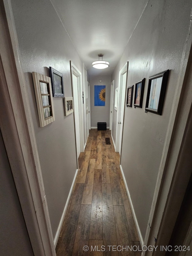 corridor featuring hardwood / wood-style flooring