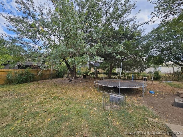 view of yard featuring a trampoline