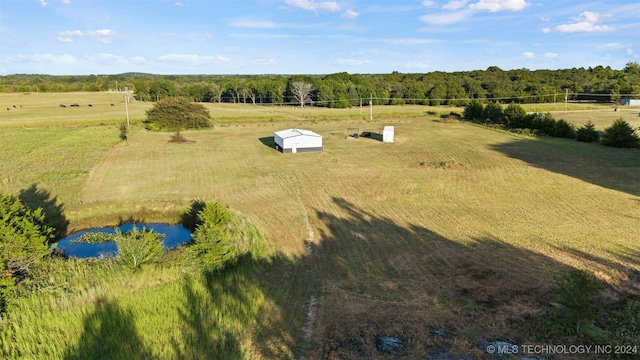 bird's eye view featuring a rural view and a water view