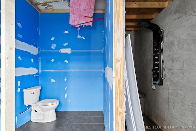 bathroom featuring tile patterned floors and toilet