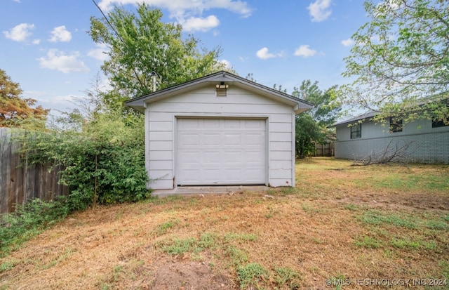 garage featuring a yard