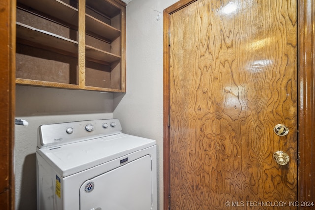 laundry area with washer / dryer