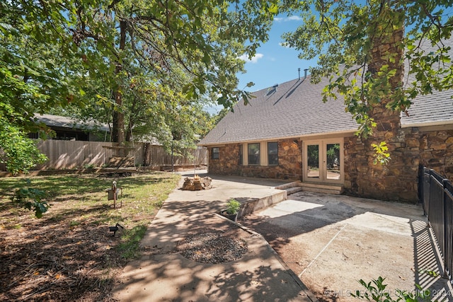 rear view of property featuring french doors and a patio