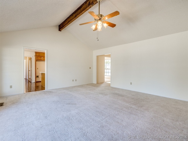 carpeted spare room featuring beamed ceiling, a textured ceiling, high vaulted ceiling, and ceiling fan