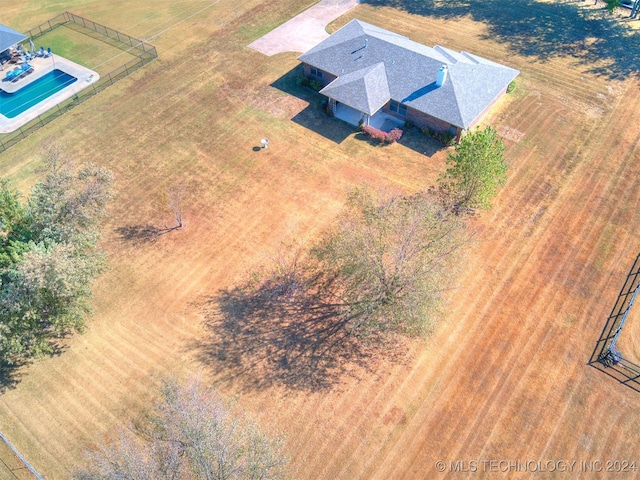 birds eye view of property with a rural view