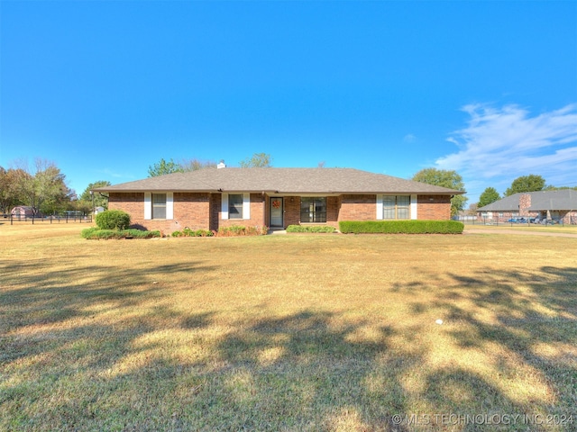 ranch-style house with a front yard