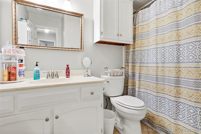 bathroom featuring vanity, toilet, and a textured ceiling