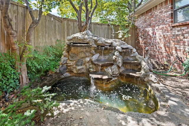 exterior space featuring a small pond