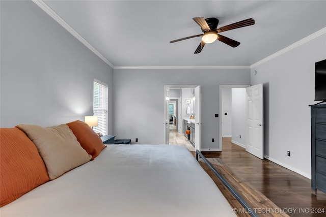 bedroom featuring ceiling fan, ensuite bath, crown molding, and dark hardwood / wood-style flooring