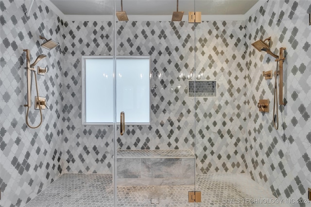 bathroom featuring walk in shower and ornamental molding