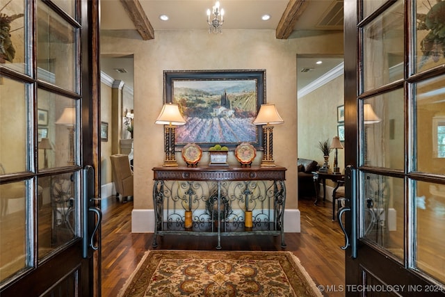 hall featuring beamed ceiling, dark hardwood / wood-style flooring, a chandelier, and crown molding