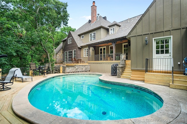 view of pool featuring a patio area