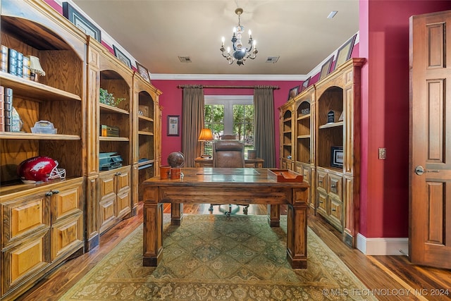 office with ornamental molding, wood-type flooring, and a notable chandelier