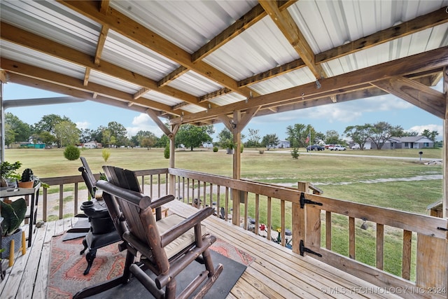 wooden deck with a lawn