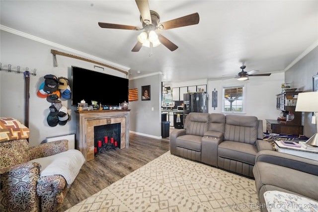 living room with crown molding, hardwood / wood-style flooring, and ceiling fan