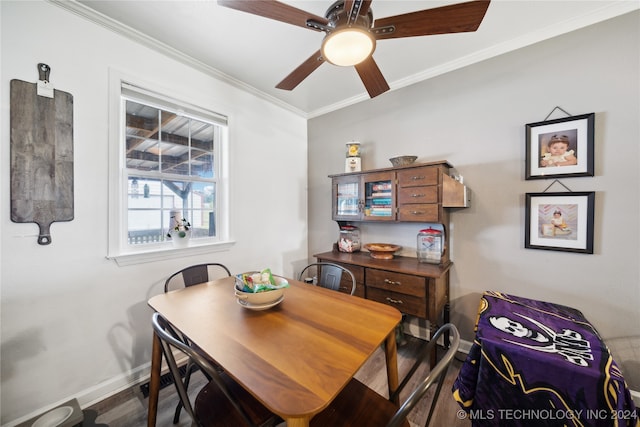 dining room featuring crown molding, dark hardwood / wood-style floors, and ceiling fan