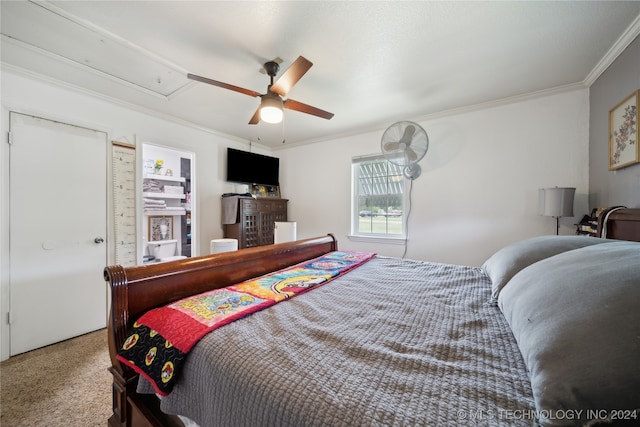 bedroom with ceiling fan, carpet flooring, and ornamental molding