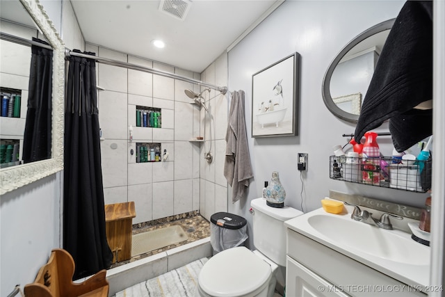 bathroom with vanity, toilet, and a shower with shower curtain