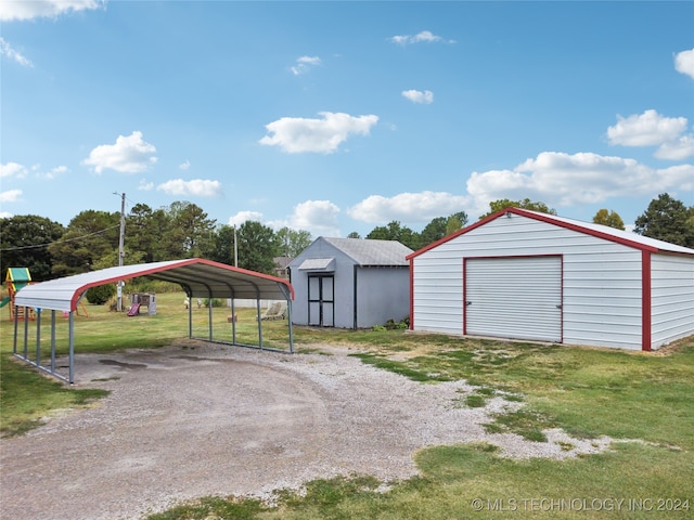 garage with a lawn and a carport