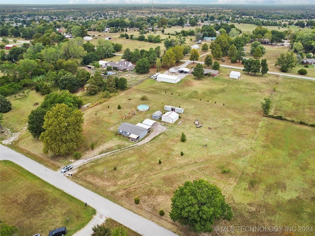 birds eye view of property featuring a rural view