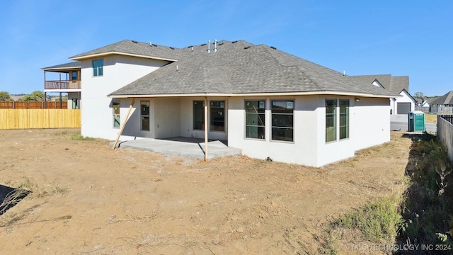 rear view of property with a patio area