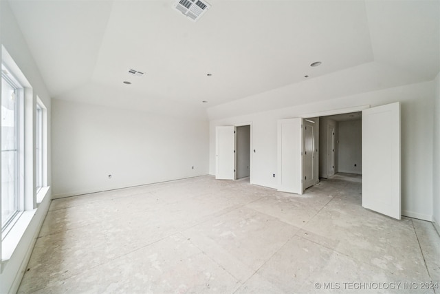 interior space featuring a raised ceiling