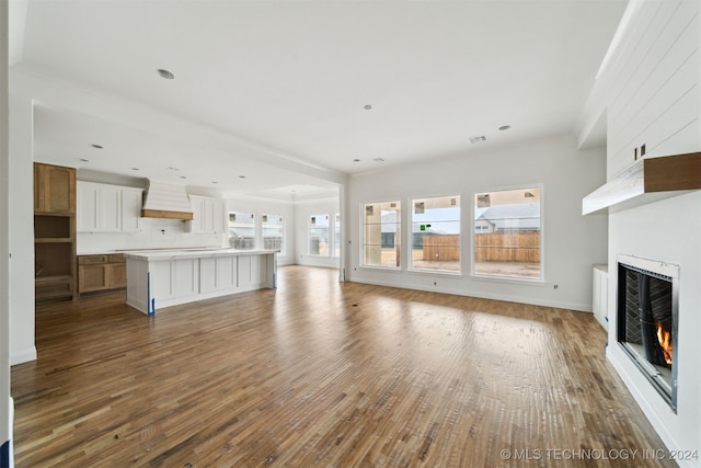 unfurnished living room featuring light hardwood / wood-style flooring