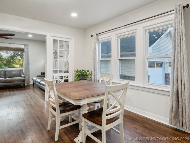 dining area with dark hardwood / wood-style floors and ceiling fan