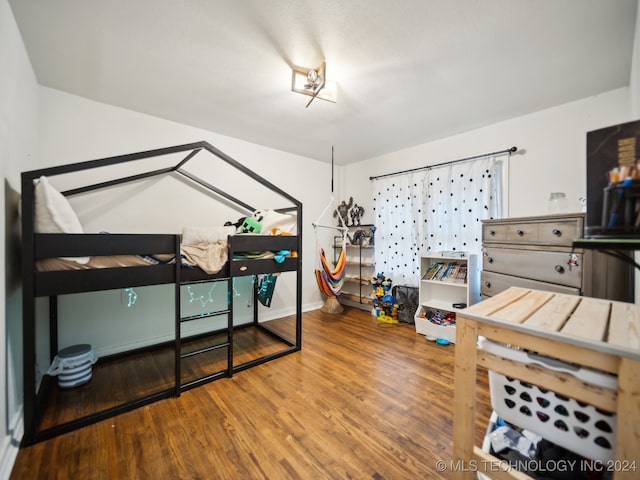 bedroom with wood-type flooring