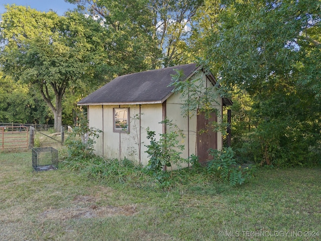 view of outdoor structure with a lawn