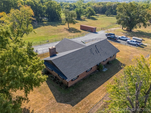 birds eye view of property with a rural view