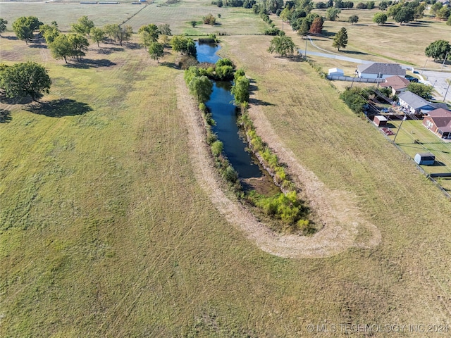 aerial view featuring a rural view and a water view