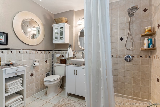 bathroom featuring tile walls, toilet, vanity, and a shower with shower curtain