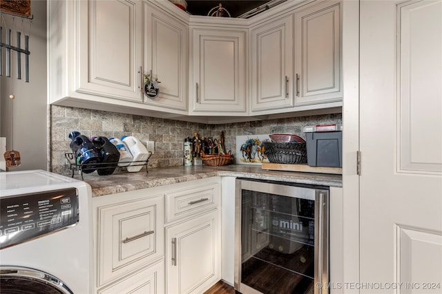 kitchen with beverage cooler, light stone countertops, range, and decorative backsplash