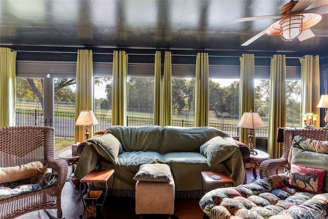 sunroom featuring ceiling fan and a wealth of natural light