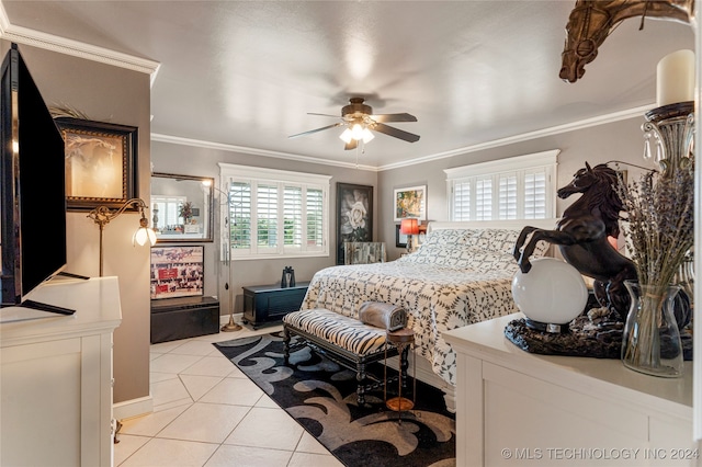 tiled bedroom with ceiling fan and ornamental molding