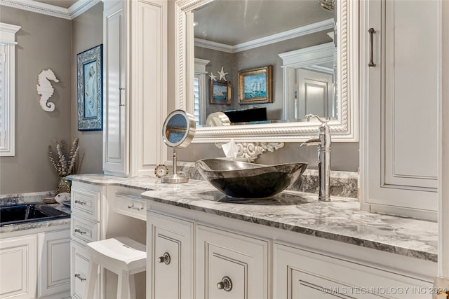 bathroom featuring vanity and crown molding