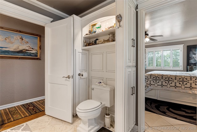 bathroom featuring wood-type flooring, ornamental molding, toilet, and ceiling fan