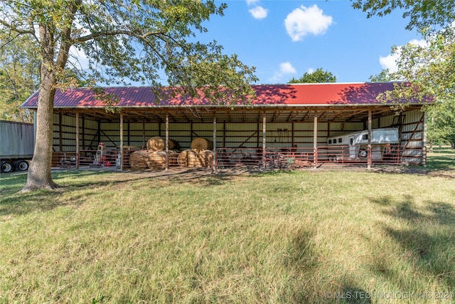 back of house with an outdoor structure