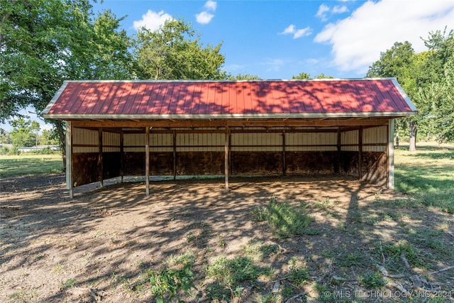 view of outbuilding featuring a carport