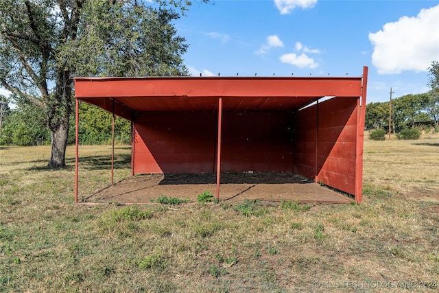 view of outbuilding featuring a lawn