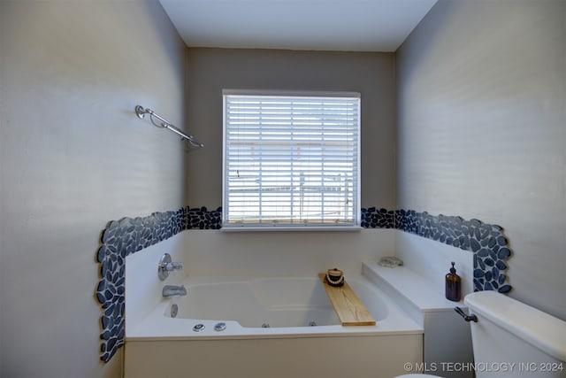 bathroom featuring a bathing tub and toilet