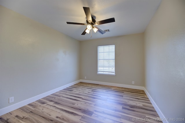 unfurnished room with ceiling fan and light hardwood / wood-style flooring