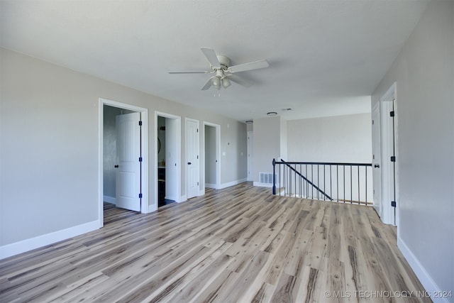 spare room with light hardwood / wood-style flooring and ceiling fan