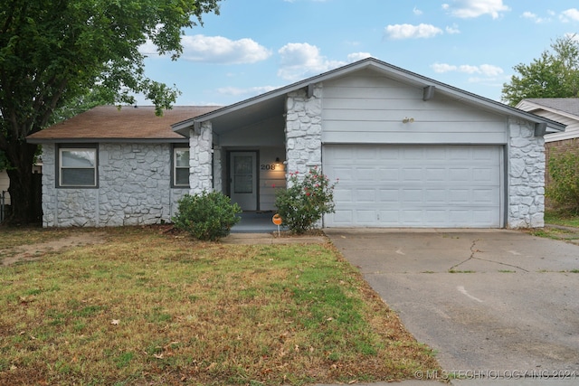 ranch-style house with a front yard and a garage