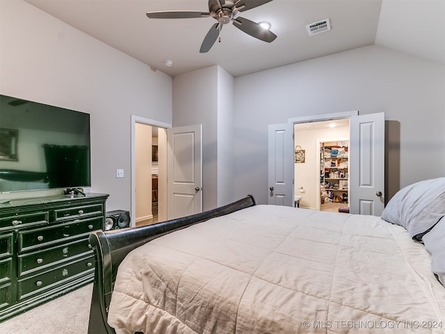 bedroom featuring carpet flooring, lofted ceiling, and ceiling fan